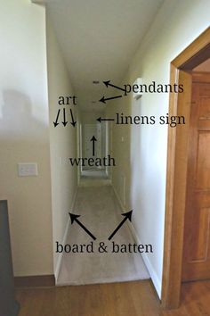 an empty hallway with arrows pointing to different rooms