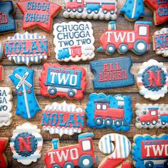 decorated cookies are displayed on a table