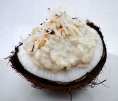 a coconut with some kind of food inside of it