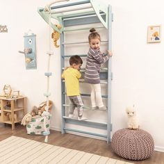 two young children climbing up and down a ladder in a child's play room