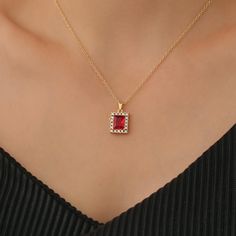 Gold baguette necklace featuring a sleek, rectangular red zirconia stone on a delicate chain, adding a touch of elegance and bold colour. Measurements: Pendant:14x12mm Chain: 14/16/18/20/22inch.All necklaces come with 2inch extender chain! All jewelry comes in a soft velvet pouch ready for gift. Materials: Gold over brass Quality promise Our jewelry is crafted with  attention to detail, offering both beauty and longevity. We use high-quality materials and a thick layer of genuine gold plating to Baguette Pendant, Baguette Necklace, Dainty Jewellery, Necklace Red, Jewellery Gift, Red Stone, Dainty Jewelry, Gold Plated Jewelry, Necklace For Women