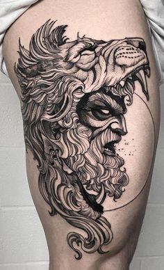 a man's thigh with a lion tattoo on it