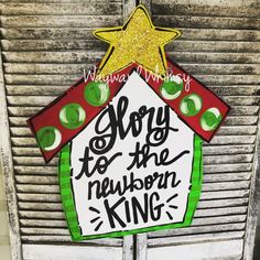 a sign that says, sorry to the newborn king on top of an old door