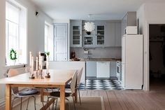 the kitchen is clean and ready to be used as a dining room or living room