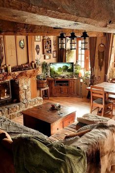 a living room filled with furniture and a flat screen tv on top of a wooden table