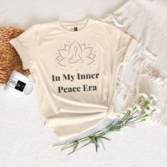 Express the tranquility of your "Inner Peace Era" with this t-shirt, designed to elevate your style and soothe your soul. Crafted with care and attention to detail, this shirt is more than just apparel--it's a wearable affirmation of mindfulness and inner harmony. Made from premium materials for ultimate comfort, our zen-inspired design is perfect for yoga sessions, meditation practices, or simply lounging in comfort and style.  With its minimalist & stylish design, our "In My Inner Peace Era" T Relaxed Fit Graphic Print Tops For Meditation, Relaxation Graphic Print Crew Neck Top, Graphic Print Crew Neck Tops For Relaxation, Crew Neck Top With Graphic Print For Relaxation, Peace Era, Inner Harmony, Meditation Practices, Inner Peace, Shirt Price