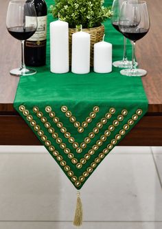 a table topped with two wine glasses and candles