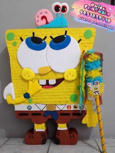 the spongebob character has been made out of construction paper and is holding a broom