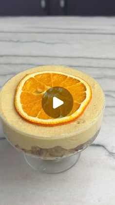 an orange slice sitting on top of a dessert