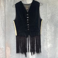 Black velvet vest from the height of Express with gorgeous exposed suiting on back  So 90s but also very timeless and high quality  Could be worn as a top with nothing underneath  Made in USA  Velvet is 100% cotton  Backing is 65% acetate 35% cotton  Labeled size medium  Measurements taken flat double when necessary  Shoulder to shoulder 14" Pit to pit 17" Shoulder to hem 28" Fringe length 20" Due to the nature of vintage, all items in my store are sold as is. All sales are final without exception, I have a no returns/refunds policy. However, please contact me if there is a problem with your order. Please refer to the FAQs at the bottom of the page of my main store for my shop policies. By purchasing from my shop you are agreeing to my shop policies. Fitted Sleeveless Vest With Fringe, Fitted Fringe Vest For Fall, Velvet Vest, Sailor Shirt, Cotton Labels, Long Fringes, Striped Tank Top, Vest Outfits, Cotton Velvet