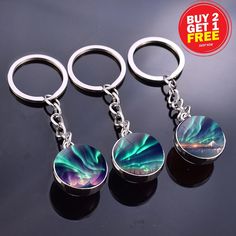 three keychains with aurora bores on them and the text buy 2 get 1 free