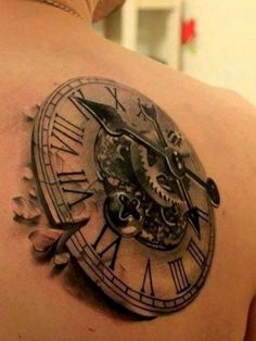 an image of a clock tattoo on the back of a man's shoulder and chest