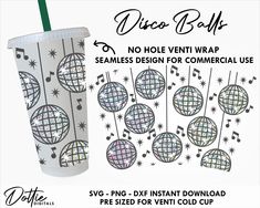 a paper cup with disco balls on the side and strings hanging from it, next to a