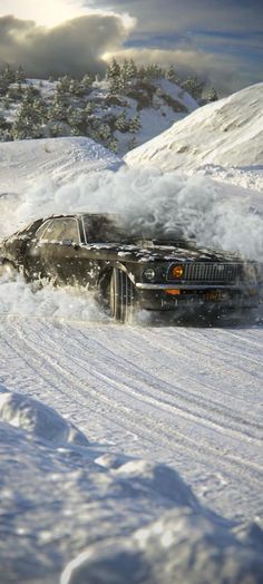 a car that is in the snow with it's hood up and its wheels out