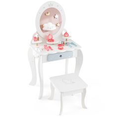 a doll's dressing table with a mirror and stool