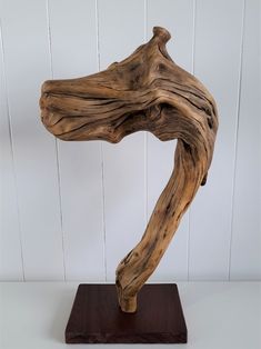 a piece of driftwood on a wooden stand