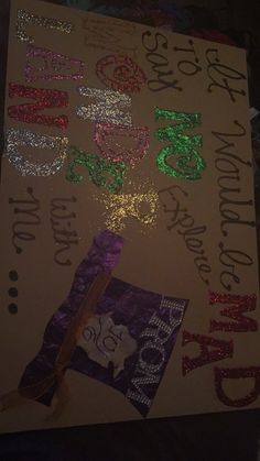 a sign that has been decorated with glitters and sparklers on the back of it