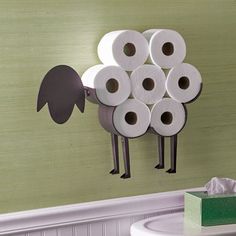 a bunch of rolls of toilet paper hanging on the wall