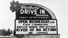 an old photo of a sign for the westbury drive in theatre, which is now open