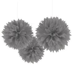 three gray pom - poms hanging from the ceiling