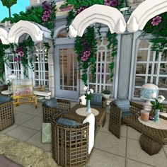 an outdoor patio with wicker furniture and flowers on the walls, along with potted plants