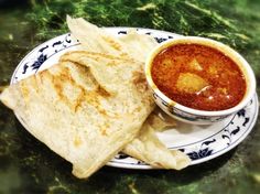 a plate with tortilla chips and salsa on it