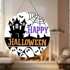 a happy halloween sign hanging from a wall