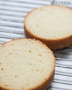 two pieces of cake sitting on top of a cooling rack