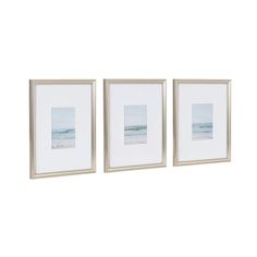 three framed pictures hanging on the wall next to each other