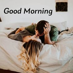 a man and woman laying in bed with the words good morning on it's side