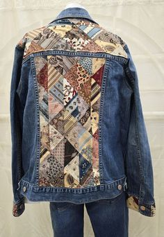 a denim jacket with patchwork on the back