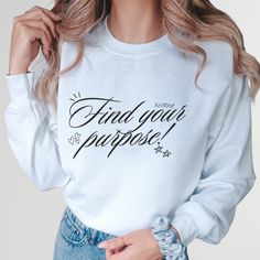 Embrace inspiration with our "Find Your Purpose" sweatshirt! This motivational quote hoodie features a powerful religious saying, perfect for uplifting your spirit. Ideal for yoga and meditation, this inspirational saying sweater is a must-have for those seeking mindfulness and peace. Whether you're a yoga teacher or a dedicated practitioner, this cozy sweatshirt reminds you to stay focused on your journey. Wear it to inspire yourself and others, making every day meaningful and purposeful. Welcome to NIOBE BOUTIQUE. I am happy to see you in my shop. My main purpose is to meet you with a high-quality product. I use the best product to make you happy. Your satisfaction is my priority.  Placing an order is simple!  *Please review all images in this listing for style, color, and sizes.  *Selec Inspirational Long Sleeve Sweatshirt With Letter Print, Inspirational Letter Print Long Sleeve Sweatshirt, Inspirational Long Sleeve Letter Print Sweatshirt, Inspirational Relaxed Fit Sweatshirt For Winter, Inspirational Long Sleeve Sweatshirt With Text Print, Affirmation Sweatshirt, Functional Crew Neck T-shirt For Yoga, Positive Affirmation Sweatshirt, Yoga Sweatshirt