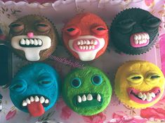 six decorated cupcakes with faces and mouths