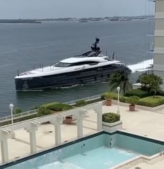 a boat is in the water near a swimming pool