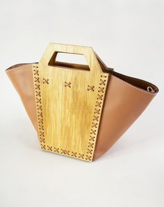 a wooden bag sitting on top of a white table