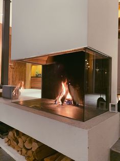 a fire is burning inside of a fireplace