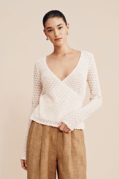 Our antique-inspired Romy Wrap Top is crafted from the softest viscose blend in an allover crochet knit. Designed for a close-fit, it features a plunging v-shaped neckline, full length sleeves and is adorned with scalloped trims. Style yours with the Leon Trouser, Nancy Pencil Skirt or high-rise denim jeans. Antique inspired crochet knit Deep V-neckline Self-wrap style with tie feature Full-length sleeves Material: 60% Polyester 40% Viscose Made in a BSCI and WRAP certified factory Knit Crochet Sweater, Sweaters Fall, High Rise Denim Jeans, Fall 24, Love Jeans, Antique Inspiration, Sleepwear & Loungewear, High Rise Denim, Fall Sweaters