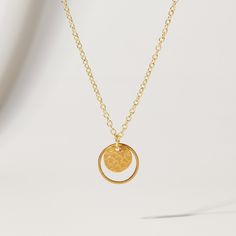 "Double Circle and Hammered Gold Disc Pendant Necklace from OhSoFitting ⭐   Want to get 20% off your first order? Join the Style Club and get a coupon for 20% off sent to your inbox! https://bit.ly/ohsoetsycoupon.⭐ The type of chic necklace never goes out of style! This 16K gold plated double circle pendant comes on a dainty gold chain and looks elegant on its own, or layered with other gold chains, pearls or beads - giving you so many styling options, every season of the year! NECKLACE DETAILS ⚬ 16K gold plated hammered disc pendant with a matte finish inside a matte gold plated circle. ⚬ Pendant is 5/8\". ⚬ 16\" 18K gold plated chain, nickel-free and hypoallergenic. QUESTIONS? Just use the \"Message Merrie\" button below and I'll be happy to help! Thanks for shopping at OhSoFitting!" Minimalist Metal Jewelry With Coin Pendant, Sterling Silver Circle Necklaces Tarnish Resistant, Tarnish Resistant Sterling Silver Circle Necklaces, Nickel Free Yellow Gold Pendant Necklace, Nickel-free Yellow Gold Pendant Necklace, Elegant Gold Coin Necklace Nickel Free, Nickel-free Yellow Gold Metal Necklace, Brass Circle Necklace For Gifts, Metal Necklace With Round Pendant For Anniversary