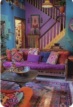 a living room filled with lots of colorful furniture