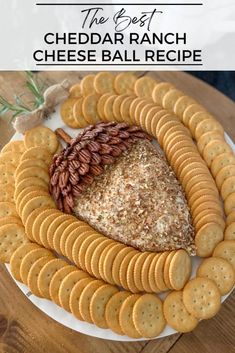 the best cheddar ranch cheese ball recipe on a white plate with crackers