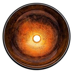 a round bowl shaped sink with an orange light in the center, on a white background