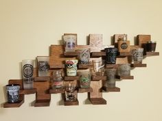 there are many different types of glasses on the wall together, including one that is made out of wooden blocks