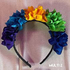 This cute Mexican Headband is made with a ribbon shaped like cute flowers. Available in both child and adult sizes. Perfect for any Mexican-themed party or event. Item can be special ordered if out of stock or for your SPECIAL EVENT. Please contact us for more info. Whimsical Headband For Carnival, Whimsical Multicolor Headband For Summer, Fun Multicolor Headband For Gift, Fun Multicolor Headband For Gifts, Fun Multicolor Headband As Gift, Whimsical Multicolor Headband For Party, Whimsical Adjustable Hair Accessories For Birthdays, Playful Multicolor Headband For Party, Whimsical Adjustable Hair Accessories For Birthday