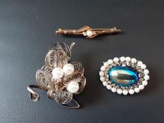 A set of 3 beautiful brooches, vintage from the 1950s. Pearls, sterling silver and gold plated. Would make the perfect Mother's day, birthday, anniversary, Christmas gift - or just to add to your collection. Please view the photos carefully as they form part of the description. Vintage Brooch Jewelry For Anniversary, Handmade Silver Costume Jewelry Brooches, Handmade Costume Jewelry Brooches For Formal Occasions, Vintage Filigree Brooches For Formal Occasions, Silver Costume Jewelry Pins, Retro Hallmarked Jewelry For Wedding, Vintage Brooch For Anniversary, Handmade Vintage Brooches For Anniversary, Vintage Brooch Lapel Pin For Gift