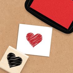 a rubber stamp with a heart drawn on it