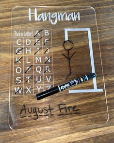 a clear acrylic sign with writing on it that says hangman august fire