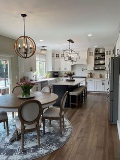 a dining room table and chairs in a kitchen