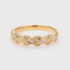 a gold ring with diamonds on it