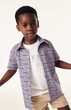 Ted Baker style starts young with a crisp cotton button-up your child will want to layer over the coordinating logo T-shirt. Shirt has front button closure; chest patch pocket Shirt is 98% cotton, 2% spandex; T-shirt is 100% cotton Machine wash, tumble dry Imported Collared T-shirt For School In Spring, Spring School T-shirt With Collar, Blue Short Sleeve Tops With Snap Buttons, Blue Short Sleeve Top With Snap Buttons, Playful Collared Cotton Shirt, Playful Tops With Button Closure For Spring, Casual Buttoned Tops For School, Playful Collared Blue Tops, Playful Blue Collared Top