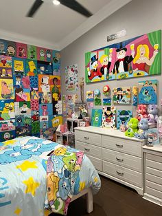 a child's bedroom decorated in cartoon characters